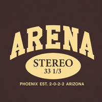A graphic print on a dark brown background featuring the word 'ARENA' in large cream-colored varsity-style letters, with 'STEREO 33 1/3' inside a matching cream oval, and 'PHOENIX EST. 2-0-2-2 ARIZONA' in smaller cream text below.