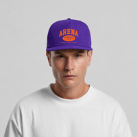 A man wearing a purple snapback cap with orange 'ARENA' and 'STEREO 33 1/3' text on the front, paired with a white t-shirt against a light gray background.