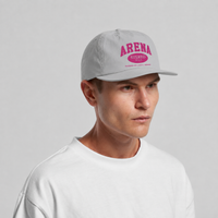 A man wearing a light gray snapback cap with a pink 'ARENA STEREO' logo on the front, paired with a white t-shirt, against a light gray background.
