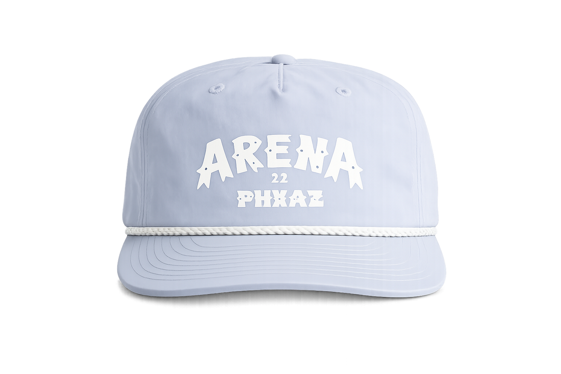 A light blue surf cap with white text reading 'ARENA 22 PHXAZ' on the front, a white rope detail across the brim, and a curved brim, shown against a plain white background.