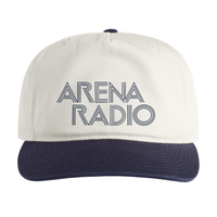 White cap with navy bill featuring 'Arena Radio' text on a white background