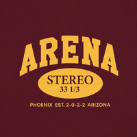 A graphic print on a maroon background featuring the word 'ARENA' in large yellow varsity-style letters, with a yellow oval below containing 'STEREO 33 1/3' and smaller yellow text reading 'PHOENIX EST. 2-0-2-2 ARIZONA'.