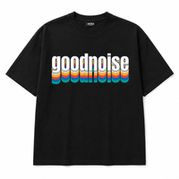 A black short-sleeve t-shirt with a retro-style graphic on the chest reading 'goodnoise' in white letters with a vertical rainbow stripe effect, shown against a plain white background.
