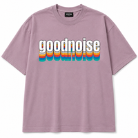 A dusty purple short-sleeve t-shirt with the word 'goodnoise' printed across the chest in white letters with a retro rainbow-striped drop shadow effect, shown on a plain white background.