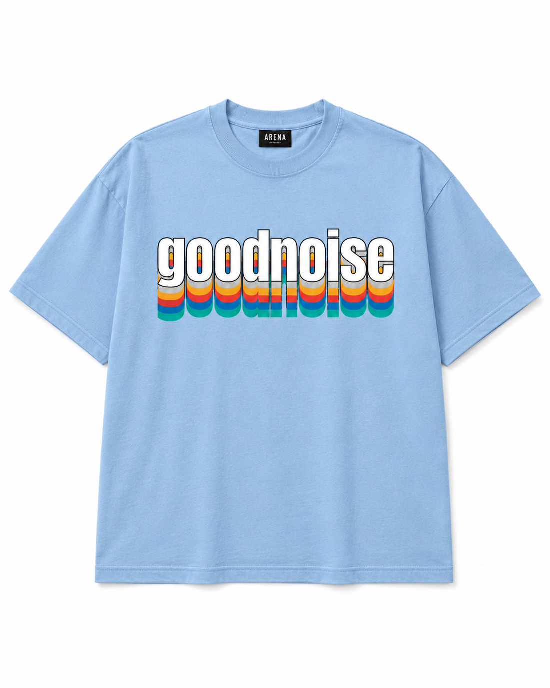 A light blue short-sleeve t-shirt with a retro-style graphic on the chest reading 'goodnoise' in white letters with a white outline, layered over vertical rainbow stripes in red, orange, yellow, green, and blue. The brand name 'ARENA' is visible on the inner neck label.