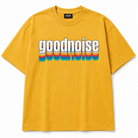 A yellow short-sleeve crewneck t-shirt featuring a retro-style graphic on the chest with the word 'goodnoise' in white letters layered over horizontal rainbow stripes.